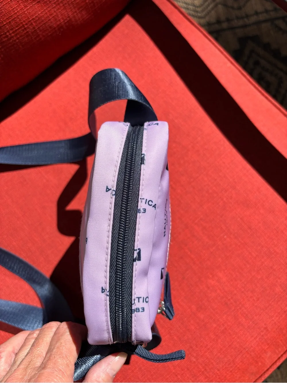 Nautica Pink Logo Print Crossbody Bag with Navy Strap and trim.